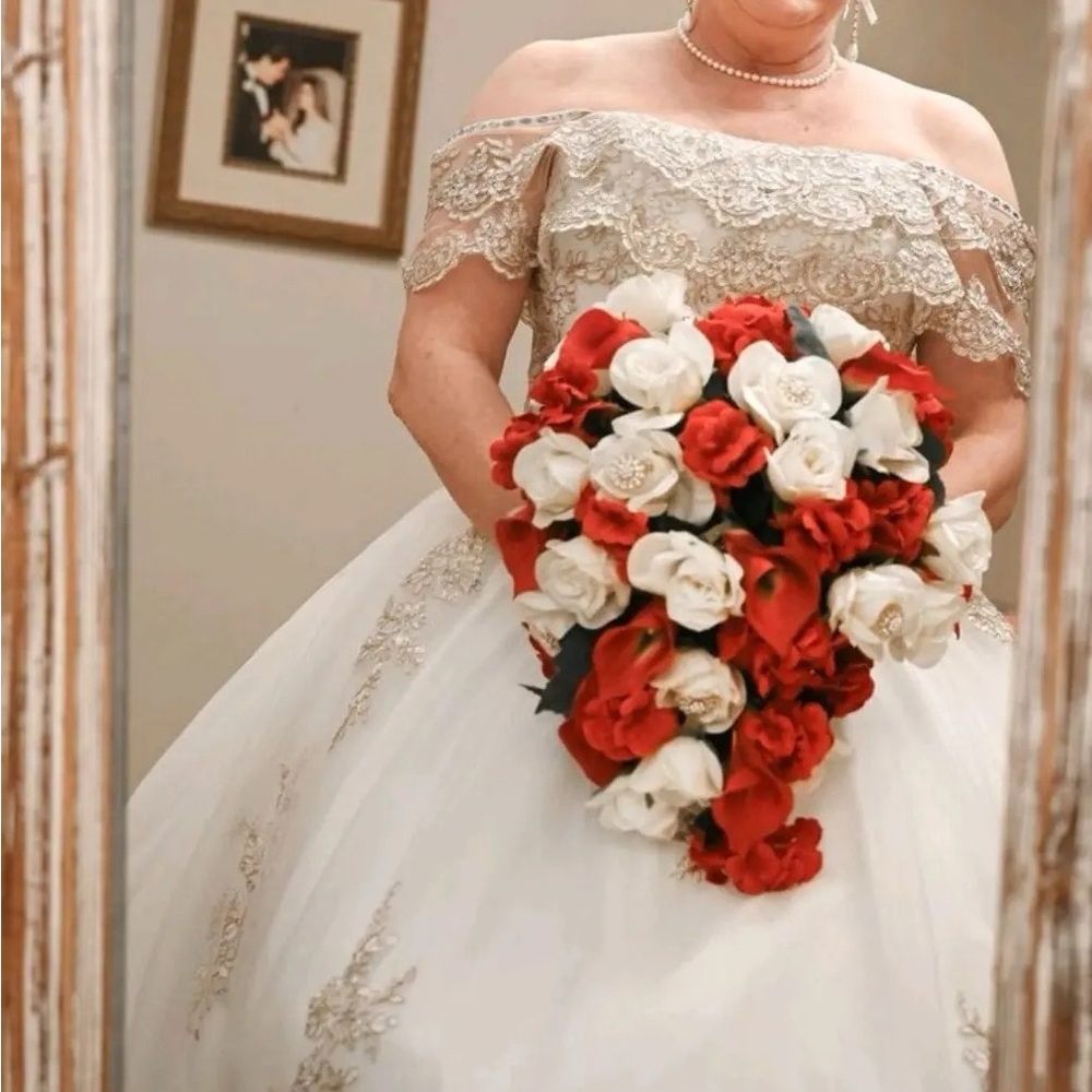 Ivory wedding or quinceañera dress with gold accents. Size 12 Layla K. dress.
